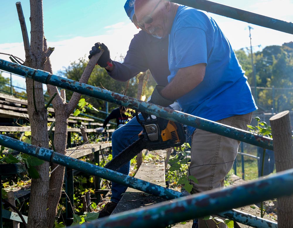 larry using chainsaw at warrior serve